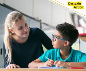 A dyslexia assessor guiding a pupil through a dyslexia assessment