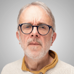 A headshot of Adrian