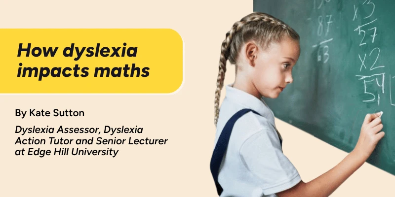 a girl stands at the board doing a maths sum