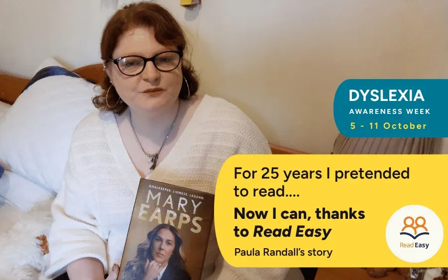 Paula Randall sits with her copy of Mary Earps autobiography that she has now been able to read